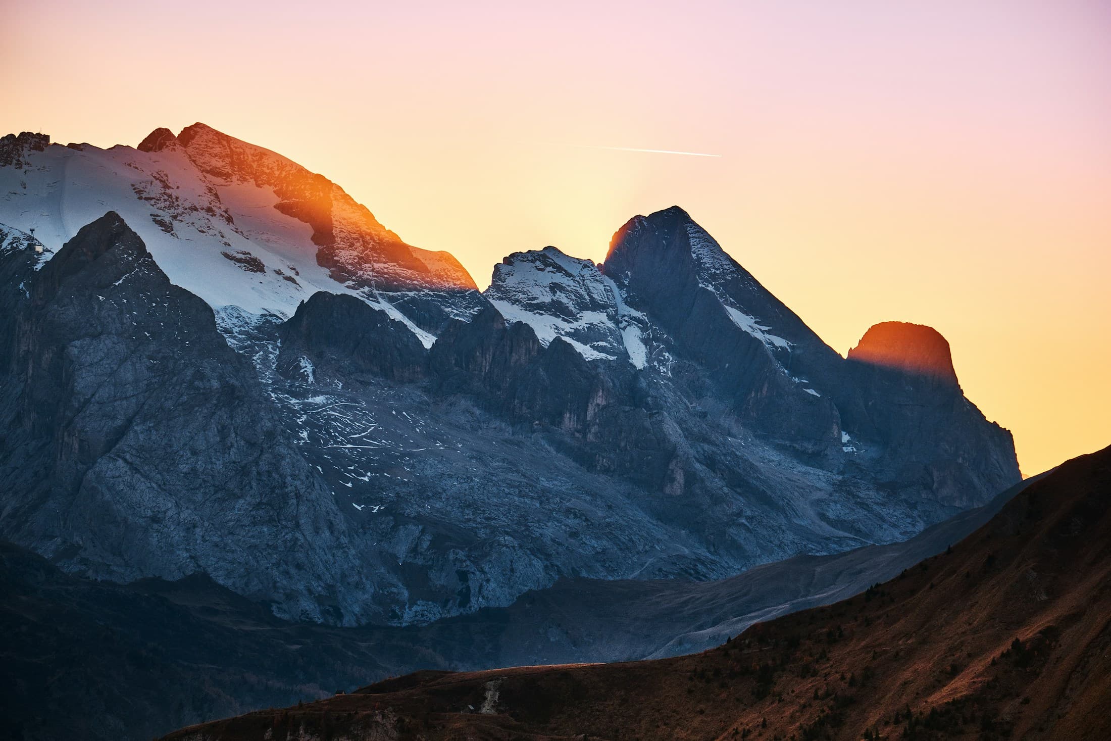 Sunset light over the peaks of the Alps